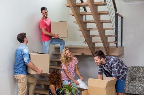 Stacked boxes and furniture ready for transparent storage pricing in Spitalfields