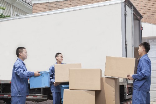 Professional movers handling furniture during a Spitalfields relocation