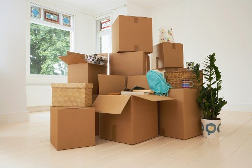 Professional movers handling fragile items during a Spitalfields relocation
