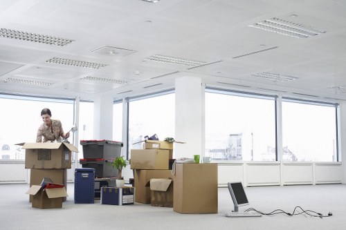 Office removals planning in Spitalfields with moving boxes and workspace organization